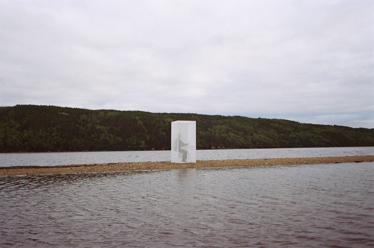 Semi-transparent Thinking Box on Thin Strip of Sand